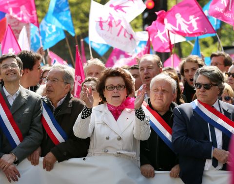 Leader of the French Christian Democratic Party, Christine Boutin, center, and MP Gilbert Collard, right, participate in an anti-gay marriage demonstration on Sunday.