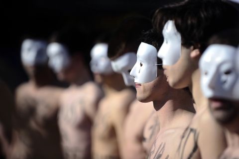 Members of the anti-gay marriage group Hommen demonstrate on Saturday, April 20, in Rennes, France. The group was created in response to Femen, a feminist group that organizes topless protests for social issues.