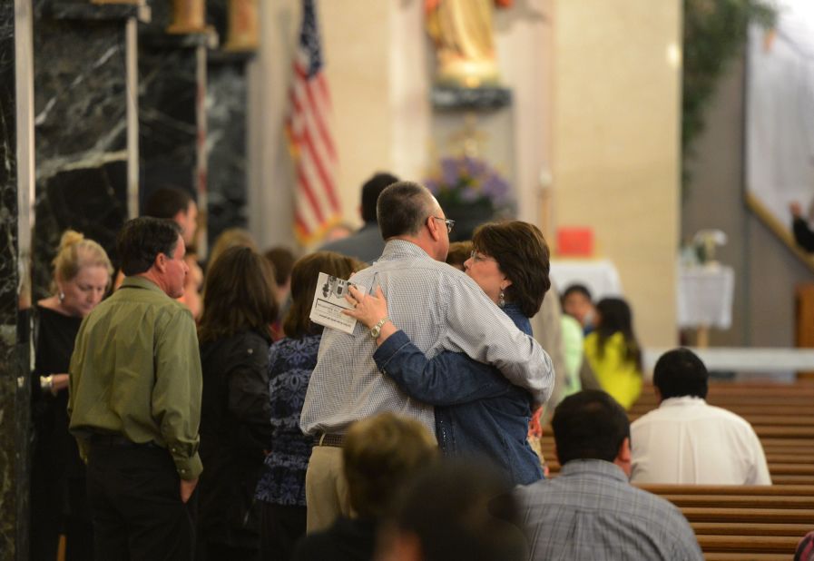 Local residents attend a commemoration ceremony on April 21 for those that perished during the fertilizer explosion.