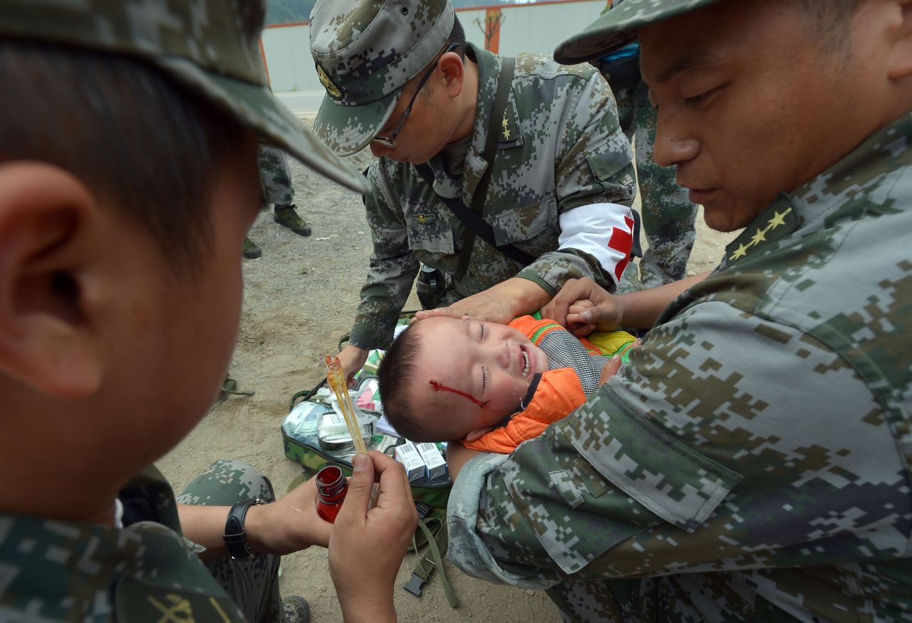 An injured boy receives treatment on Monday.