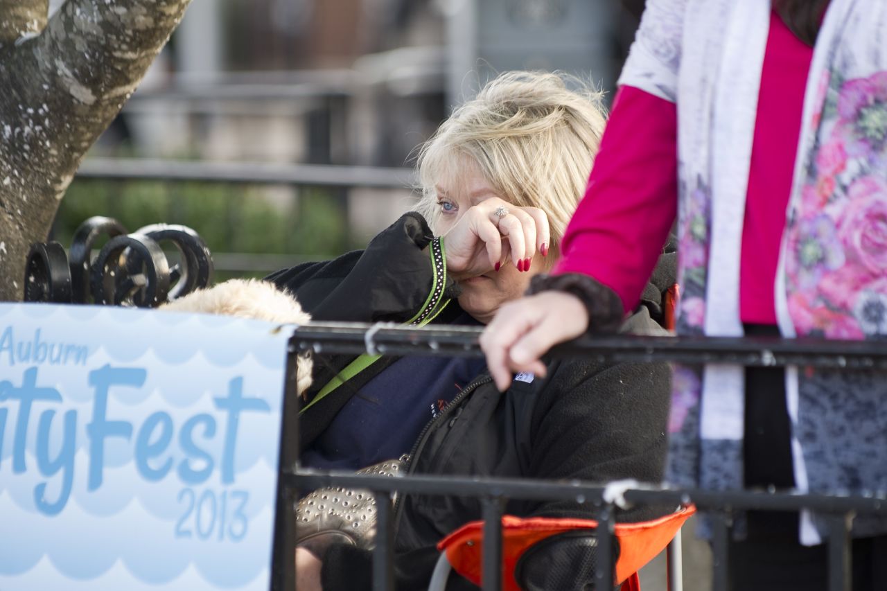 A spectator wipes away a tear Tuesday.