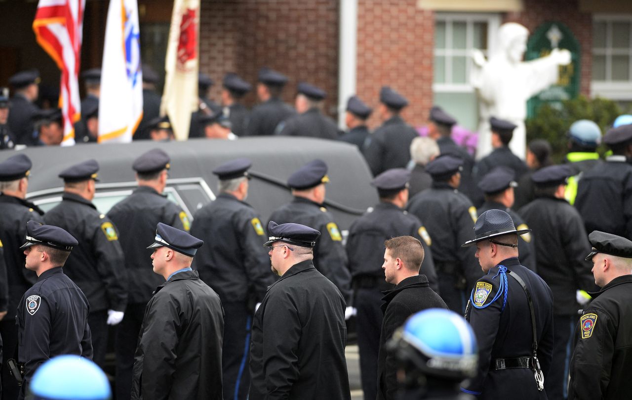Law enforcement officials enter St. Patrick's Church prior to Collier's funeral in Stoneham, Massachusetts, on April 23, 2013.