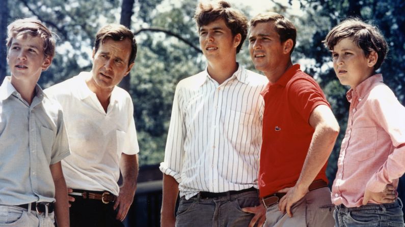 Bush, in the red shirt, is seen with his father and his three brothers in 1970. From left are Neil, George H.W., Jeb, George W. and Marvin.