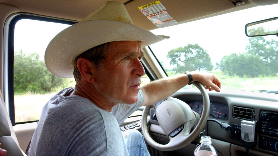 Bush drives his pickup truck at his ranch in Crawford, Texas, in 2002.
