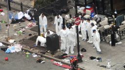 BOSTON - APRIL 16:  Investigators in white jumpsuits work the crime scene on Boylston Street following yesterday's bomb attack at the Boston Marathon April 16, 2013 in Boston, Massachusetts. Security is tight in the City of Boston following yesterday's two bomb explosions near the finish line of the Boston Marathon, that killed three people and wounding hundreds more.  (Photo by f