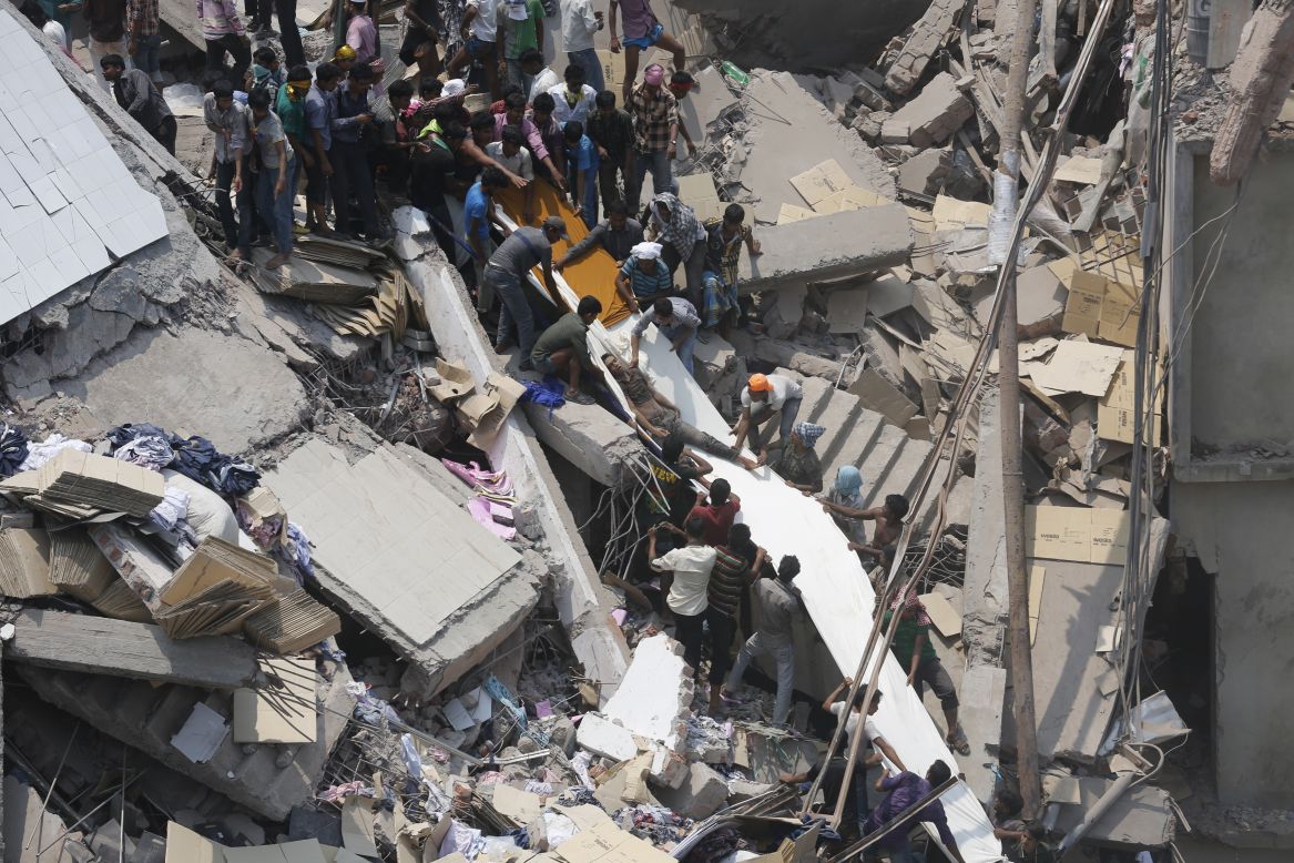 People search for garment workers trapped under the debris on April 24.