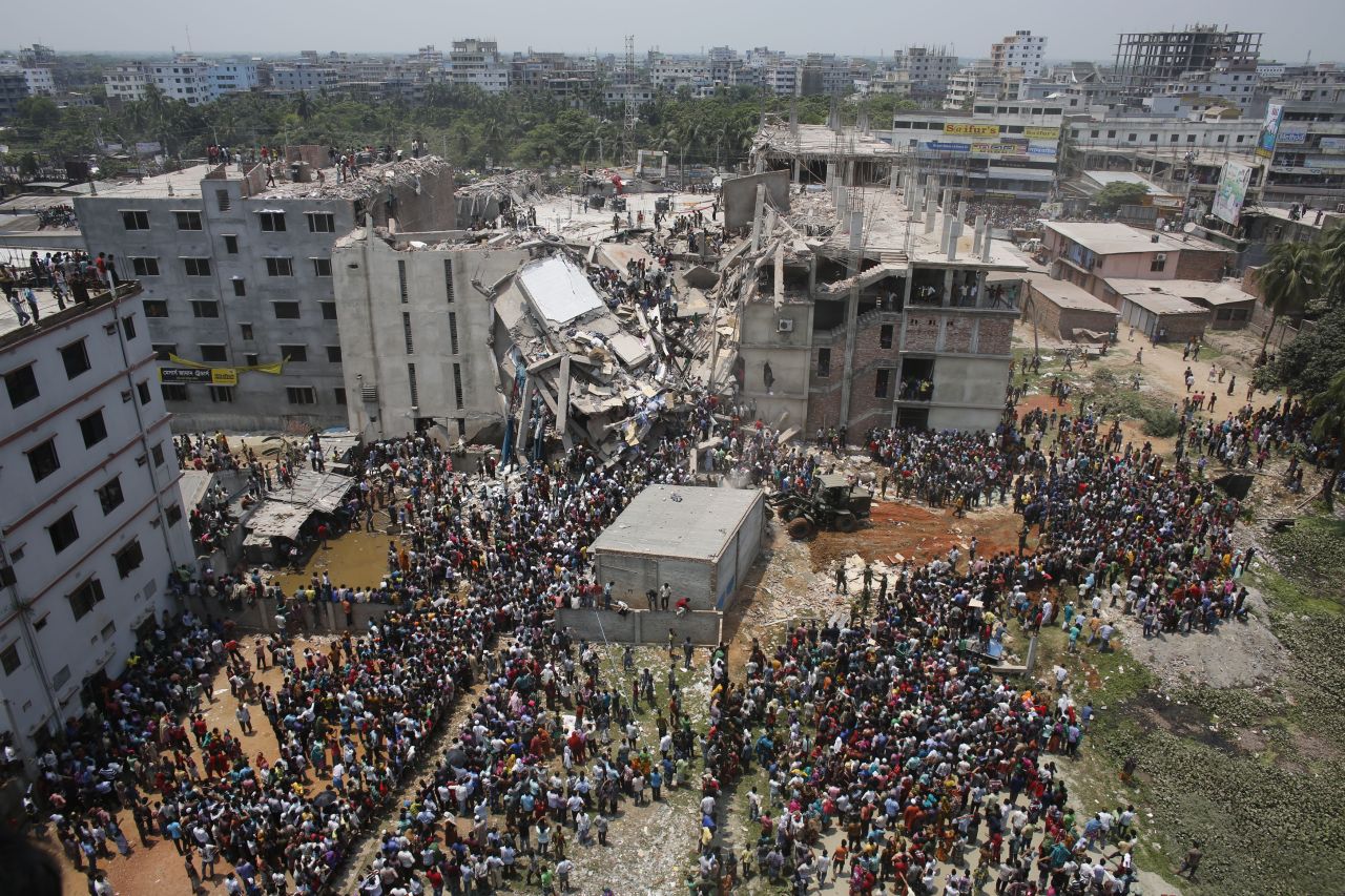 Crowds gather around the collapsed building on April 24.