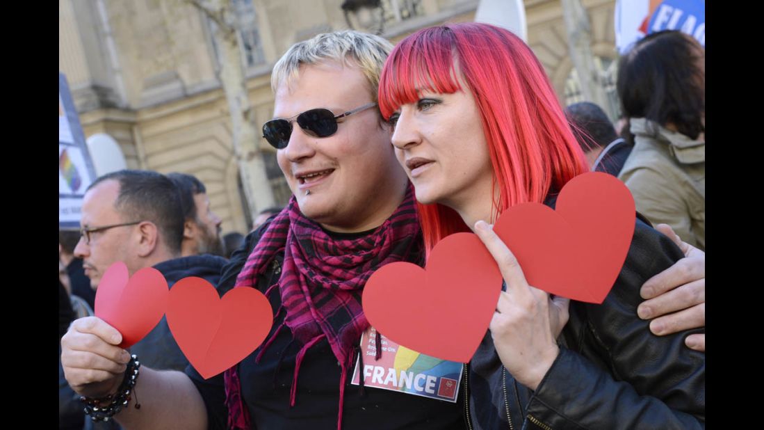 Supporters of same-sex marriage pose for photos during Tuesday's celebrations in Paris.