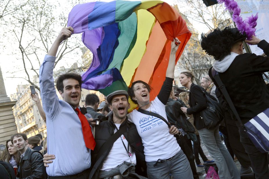 People celebrate at Paris City Hall on Tuesday, April 23, after the <a href="http://www.cnn.com/2013/04/23/world/europe/france-same-sex-vote/index.html">French National Assembly adopted a bill legalizing same-sex marriage</a> and adoptions for gay couples. 