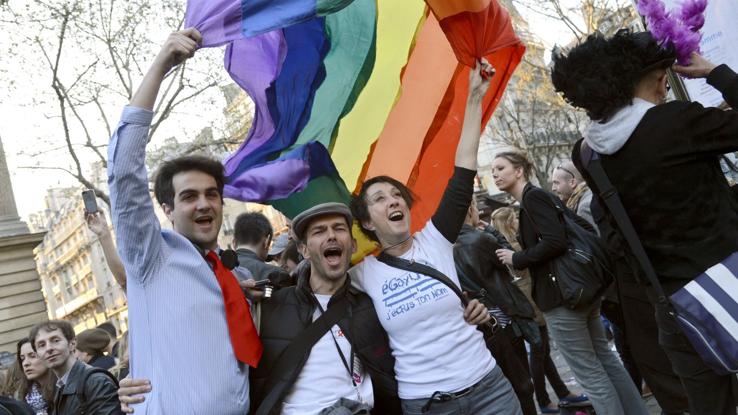 People celebrate in Paris on April 23, 2013, after the French National Assembly adopted a bill legalizing same-sex marriages.