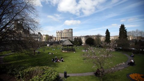 People take in the spring sunshine at Parade Gardens in Bath, England, on April 23.