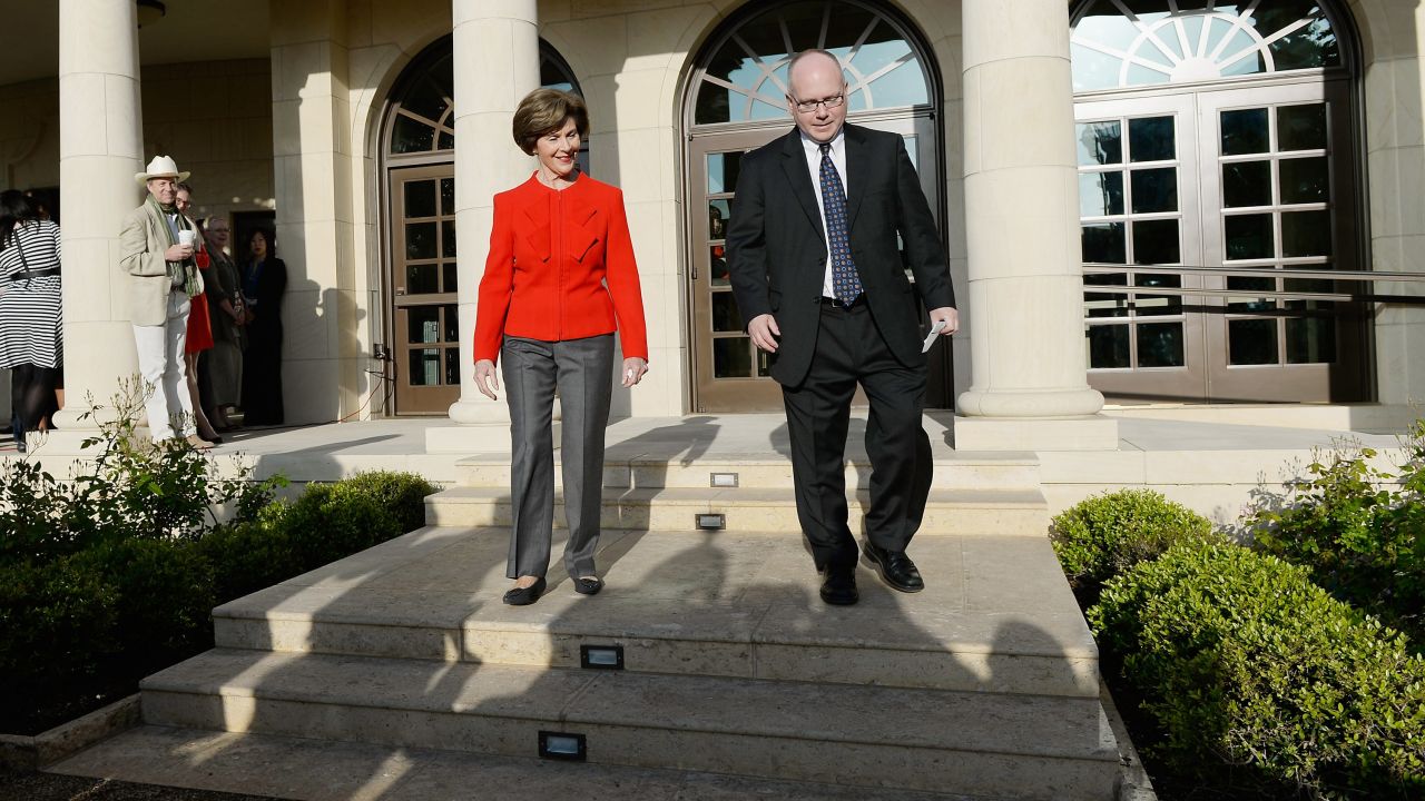 Former first lady Laura Bush and Alan Lowe, director of the George W. Bush Presidential Library, arrive to speak to media during a tour of the center.