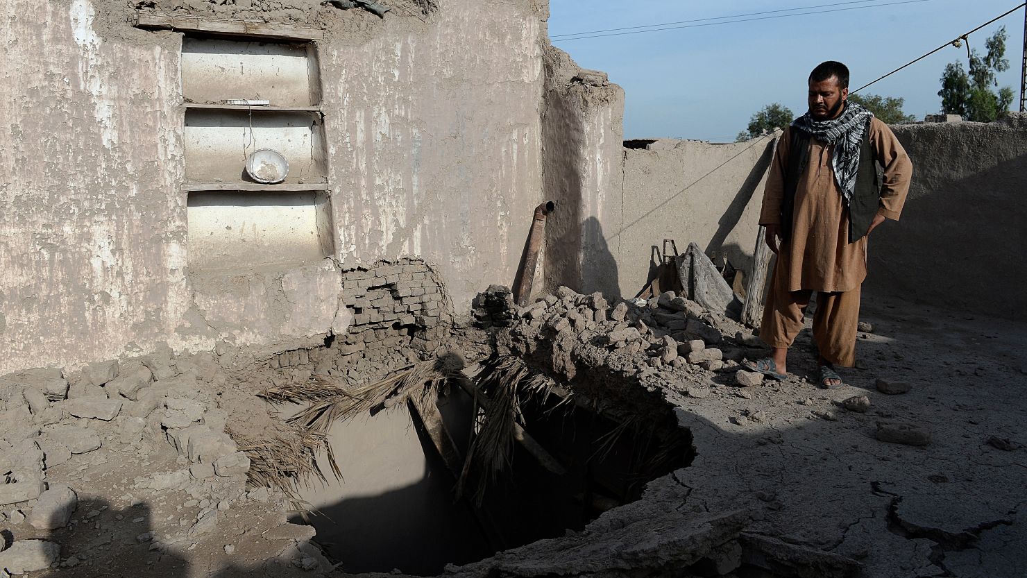 A resident on the roof of a home damaged by a earthquake in Charbagh village, Nangarhar province on April 24, 2013.