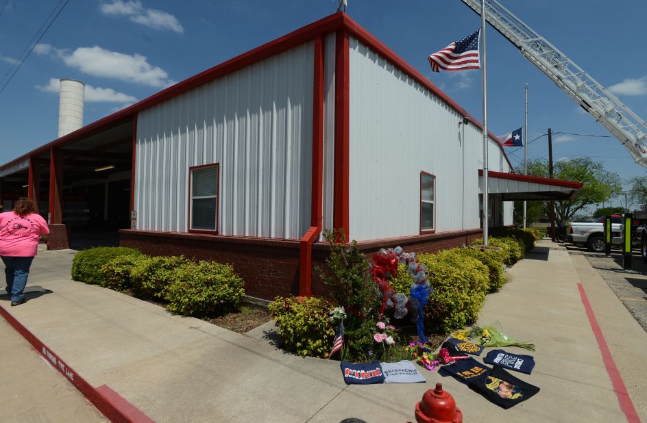 A memorial is set up on Monday, April 22, outside a fire station for the firemen who perished in the explosion.