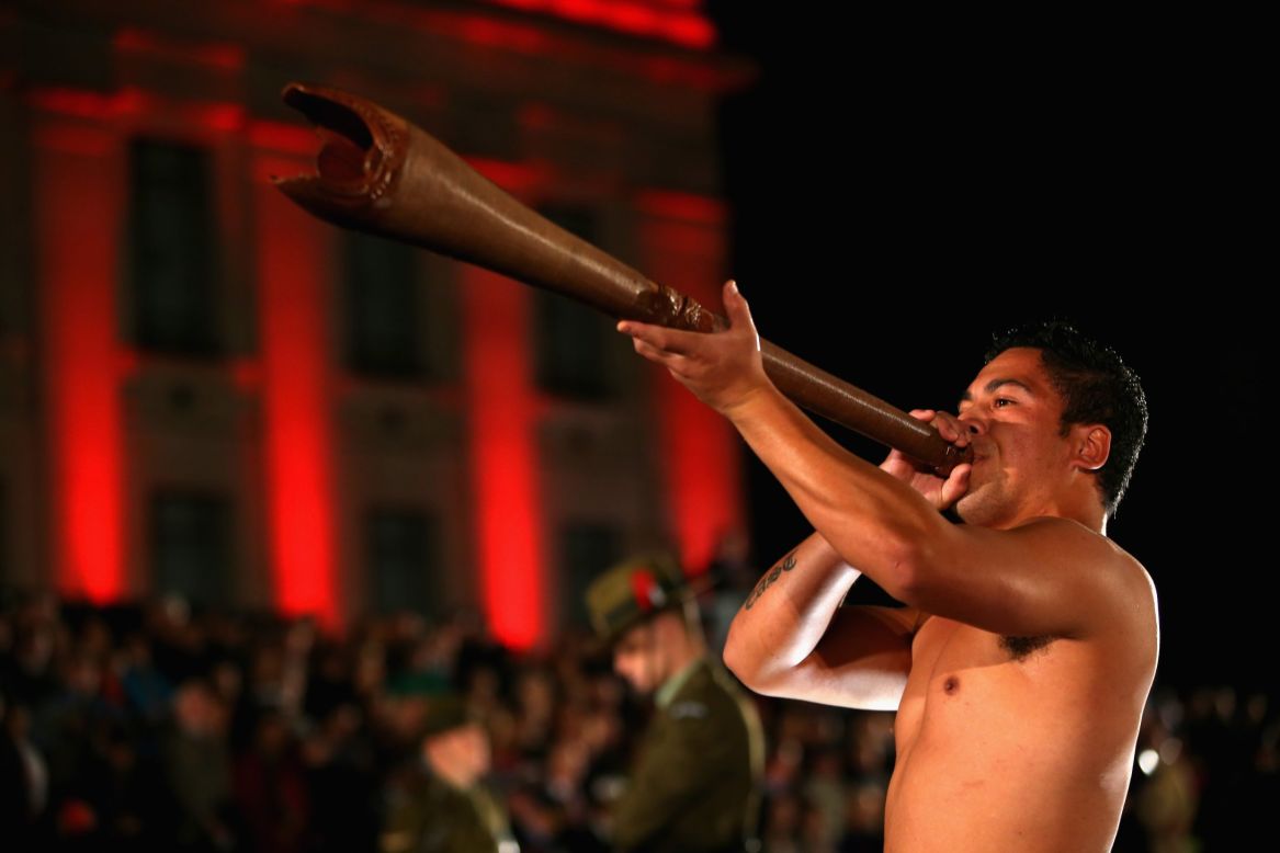 A Maori warrior plays a Pukaea (Maori trumpet) at the Cenotaph during the ANZAC Day dawn service at the Auckland War Memorial Museum on Thursday in Auckland, New Zealand. ANZAC Day is a public holiday in both Australia and New Zealand and commemoration events are held in remembrance of those who fought and died in all wars.  