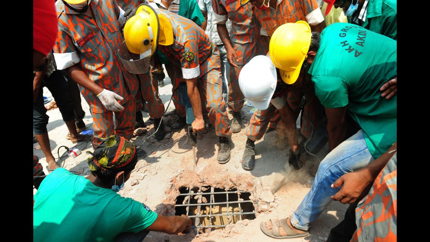 Bangladeshi firefighters cut a hole through concrete during rescue operations on April 25 in Savar, a suburb of Dhaka.