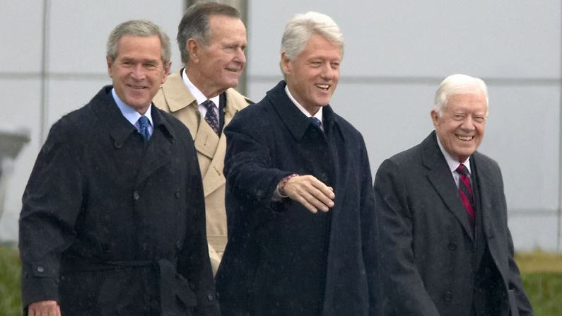 George W. Bush, George H. W. Bush, Bill Clinton and Jimmy Carter appeared together during the opening ceremony of the Clinton Presidential Library on November 18, 2004, in Little Rock, Arkansas.