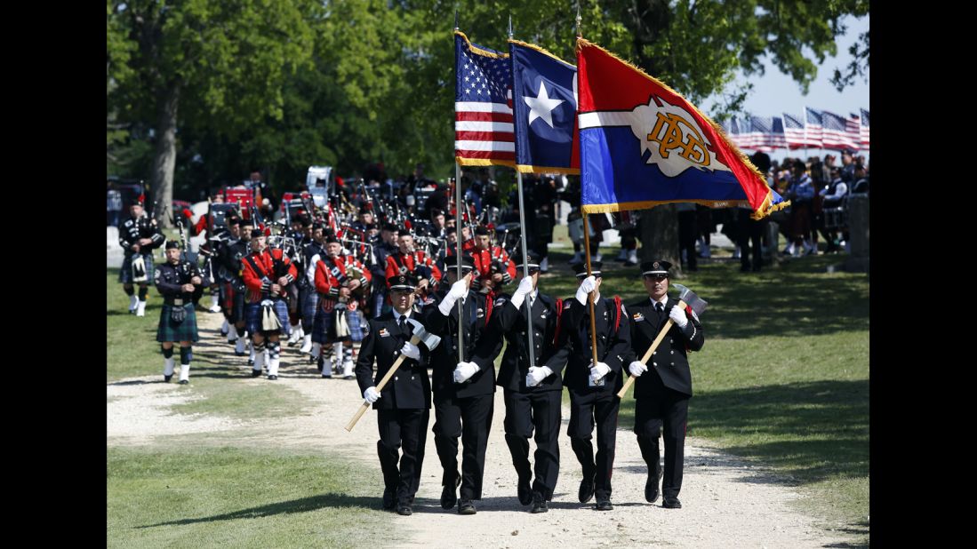 Firefighters lead the funeral procession for Capt. Kenneth "Luckey" Harris Jr. on Thursday, April 24, in West, Texas. 