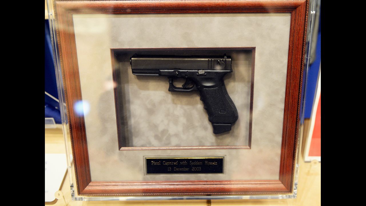 A pistol captured with Saddam Hussein on December, 13, 2003, is displayed at the Center.