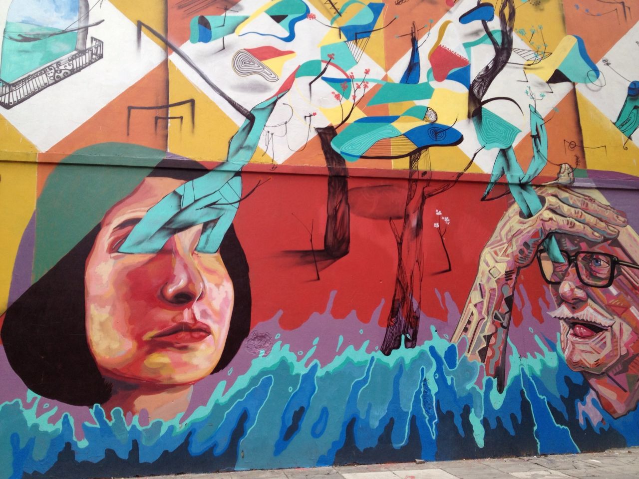Surreal street art is seen on a side street near Plaza Guemes.