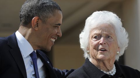 President Obama speaks with former first lady Barbara Bush during the ceremony.