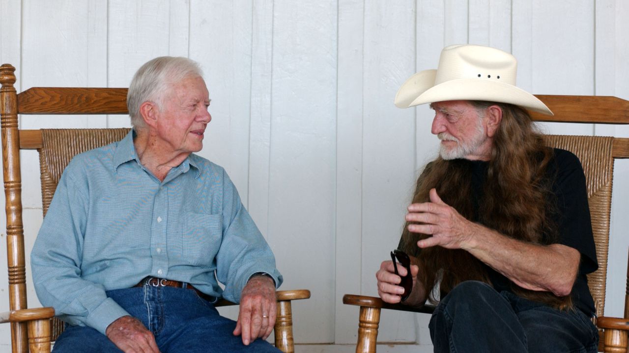 Former President Jimmy Carter and Nelson talk at the taping of "CMT Homecoming: Jimmy Carter in Plains," in December 2004.