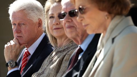 Left to right: Former President Bill Clinton, former first lady Hillary Clinton, former President Jimmy Carter and former first lady Rosalynn Carter listen during the opening ceremony.