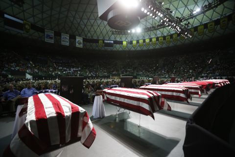 Coffins containing the remains of victims from the fertilizer plant explosion in the town of West, Texas, at a memorial on April 25.