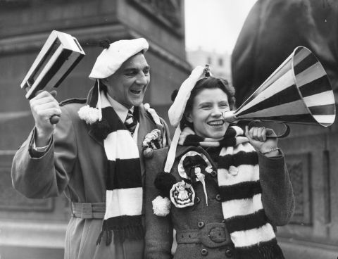 These happy fans are on their way to the English FA Cup final in 1952 but they would not be allowed to support their team using rattles or loudhailers at many global stadiums today.