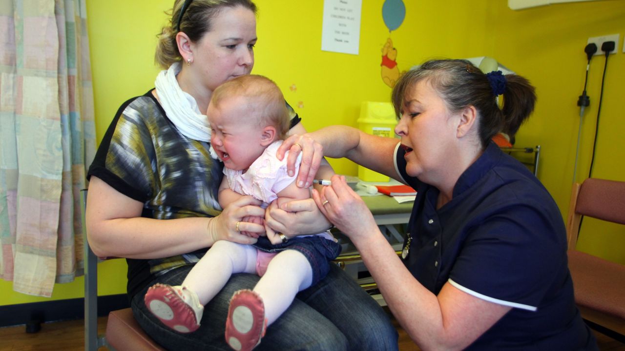 An infant receives the measles, mumps and rubella vaccination at a clinic last week near Swansea, Wales.