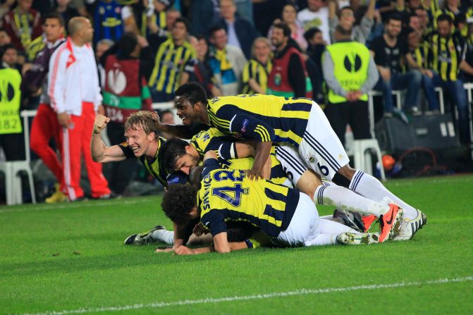 Fenerbahce players celebrate their winning goal in the Europa League semifinal first leg against Benfica. 