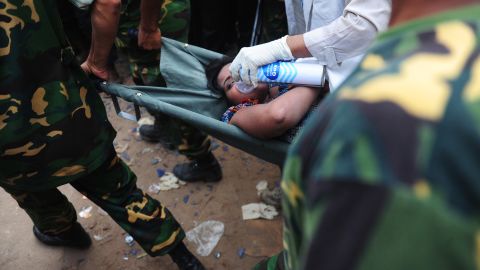 Bangladeshi army personnel recover a survivor from rubble on April 26, 48 hours after the collapse.