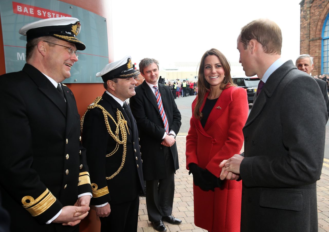 Rear Adm. Simon Robert Lister and Cmdr. Steve Garrett greet Catherine and her husband, Prince William, as they visit the Astute-class Submarine Building on April 5.