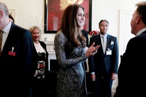 On her first public engagement since early January, the Duchess talks with the trustee at Hope House residential center, run by Action on Addiction for recovering addicts, on February 19 in London.