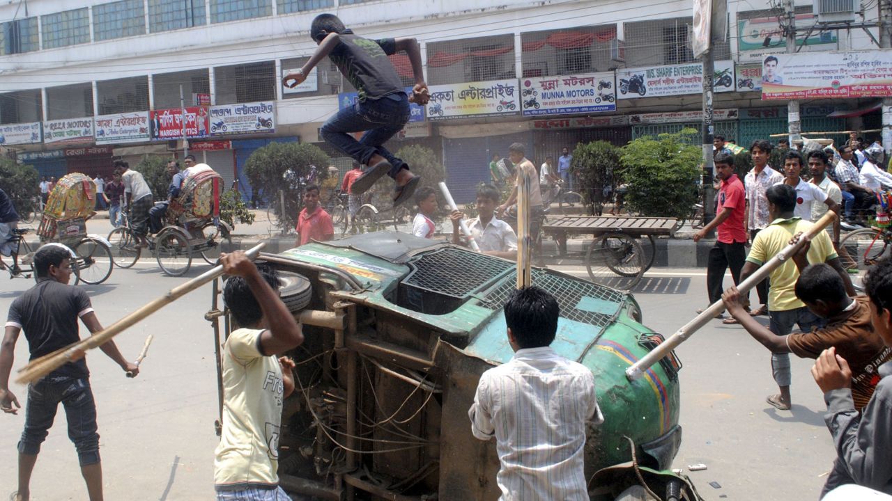 Garment workers block a street in Savar, demanding the arrest of the owner of the Rana Plaza building.