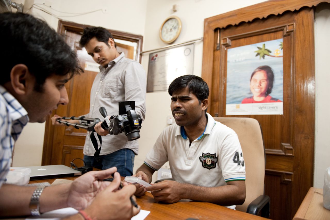 Dagar is seen here testing a prototype interface with a visually impaired volunteer.