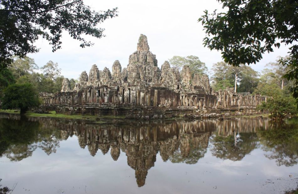 Scattered between the twisting roots of the Cambodian jungle, this site dedicated to the Hindu god Vishnu contains the remains of Khmer Empire capitals dating from the 9th to the 15th centuries. Among the most famous of its 100-strong group of monuments is the Temple of Angkor Wat and, at Angkor Thom, the sculptural Bayon Temple.