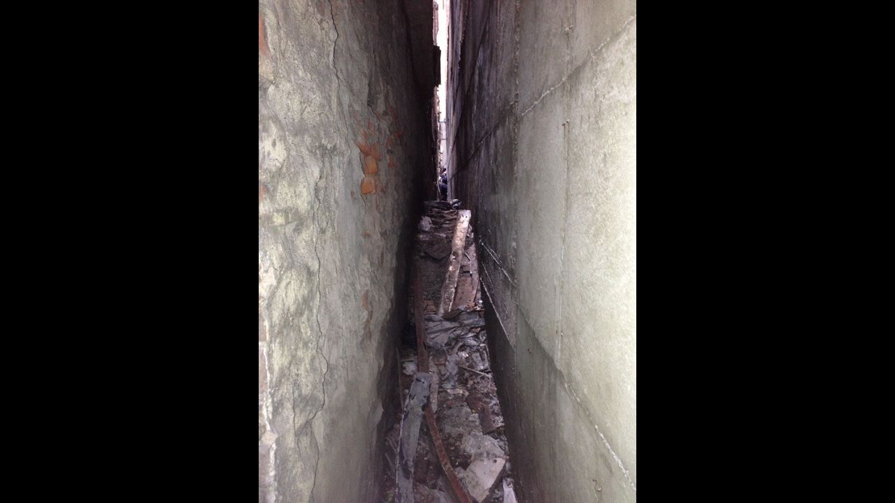 Part of a landing gear was discovered wedged between 51 Park Place and another building.