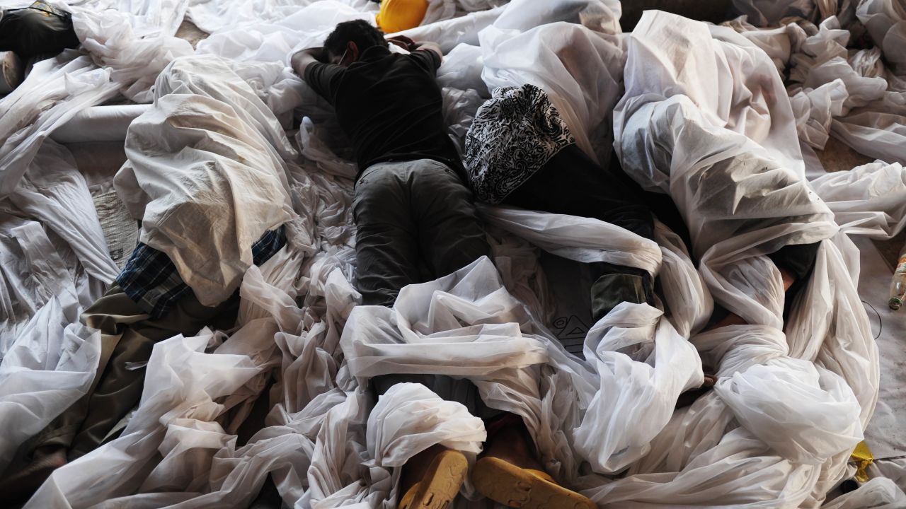 Volunteers sleep before they begin more rescue operations on April 28.