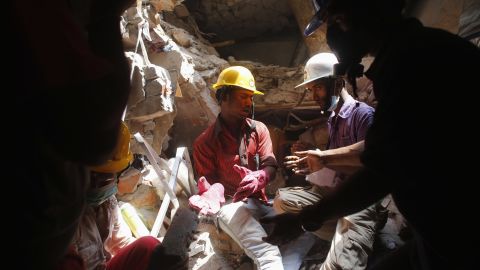 Rescue workers search for survivors on April 28.