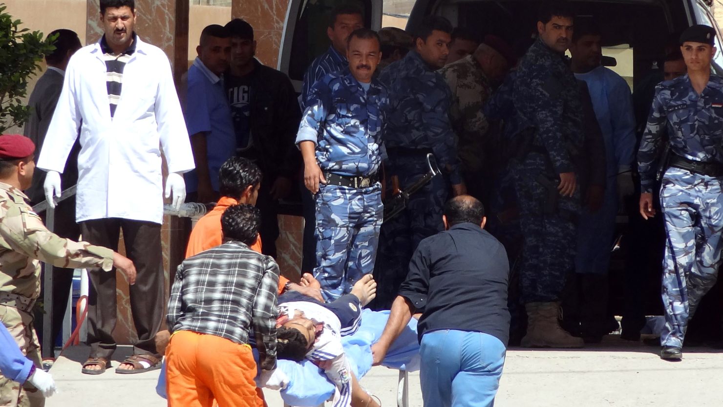 Iraqi medics wheel a man into a hospital after clashes between security forces and protesters April 23 near Kirkuk. 
