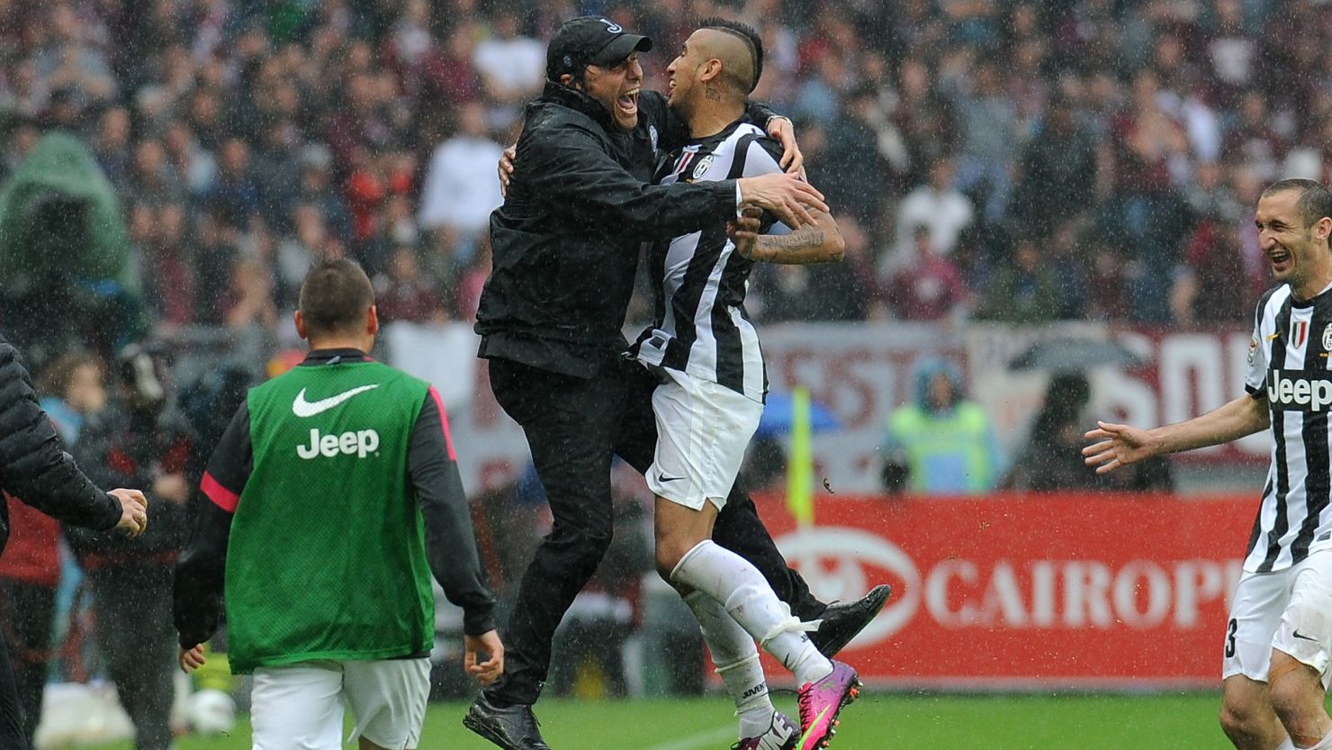 Arturo Vidal celebrates with coach Antonio Conte after opening the scoring for Juventus against Torino. 