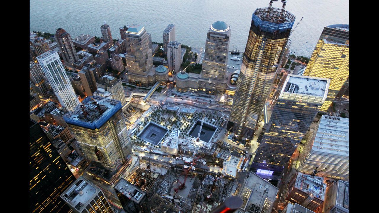 Construction continues on One World Trade Center on August 12, 2011, beside the memorial footprints of the twin towers.