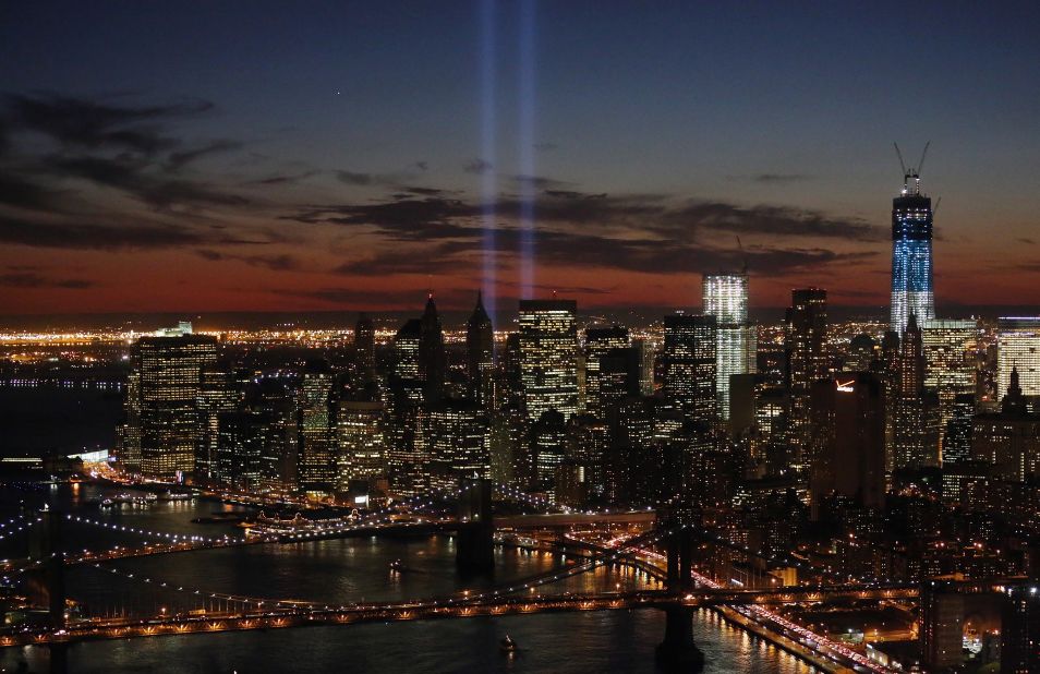The "Tribute in Light" shines near the spots where the twin towers once stood as red, white and blue light up the new building on the 11th anniversary of the attacks. 
