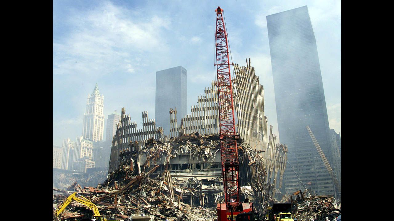 A crane works on the remains of one of the twin towers on September 18, 2001.