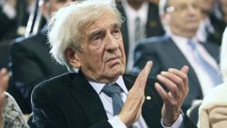 Elie Wiesel claps as U.S. President Barack Obama speaks at the Holocaust Museum April 23, 2012 in Washington, DC.