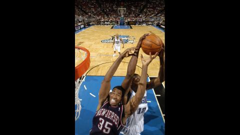 Dwight Howard of the Orlando Magic steals the ball from the Nets' Collins in 2005 in Orlando, Florida. 