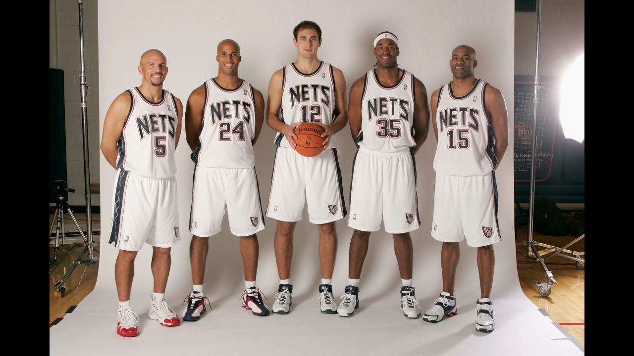 New Jersey Nets starting five, Jason Kidd (5), Richard Jefferson (24),  Nenad Krstic (12), Jason Collins (35) and Vince Carter (15), pose for  photographers during media day Monday, Oct. 2, 2006 in