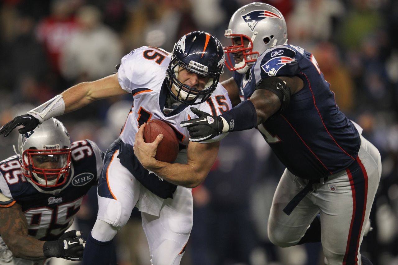 Tebow, playing for the Denver Broncos, runs the ball against the Patriots during a playoff game in January 2012. Tebow spent two seasons with the Broncos, who drafted him with a first-round pick in 2010.