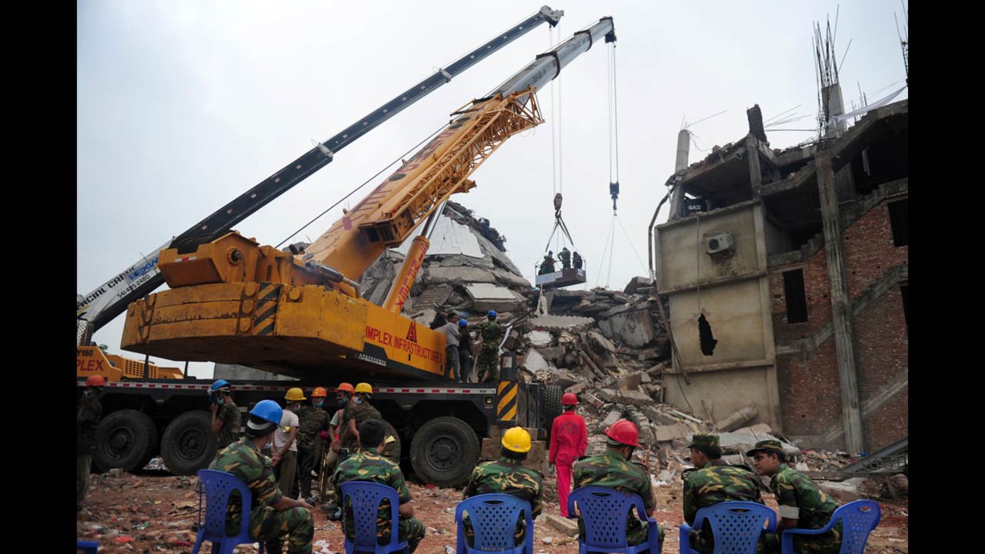 Bangladeshi army personnel begin the second phase of the rescue operation using heavy equipment on April 29.
